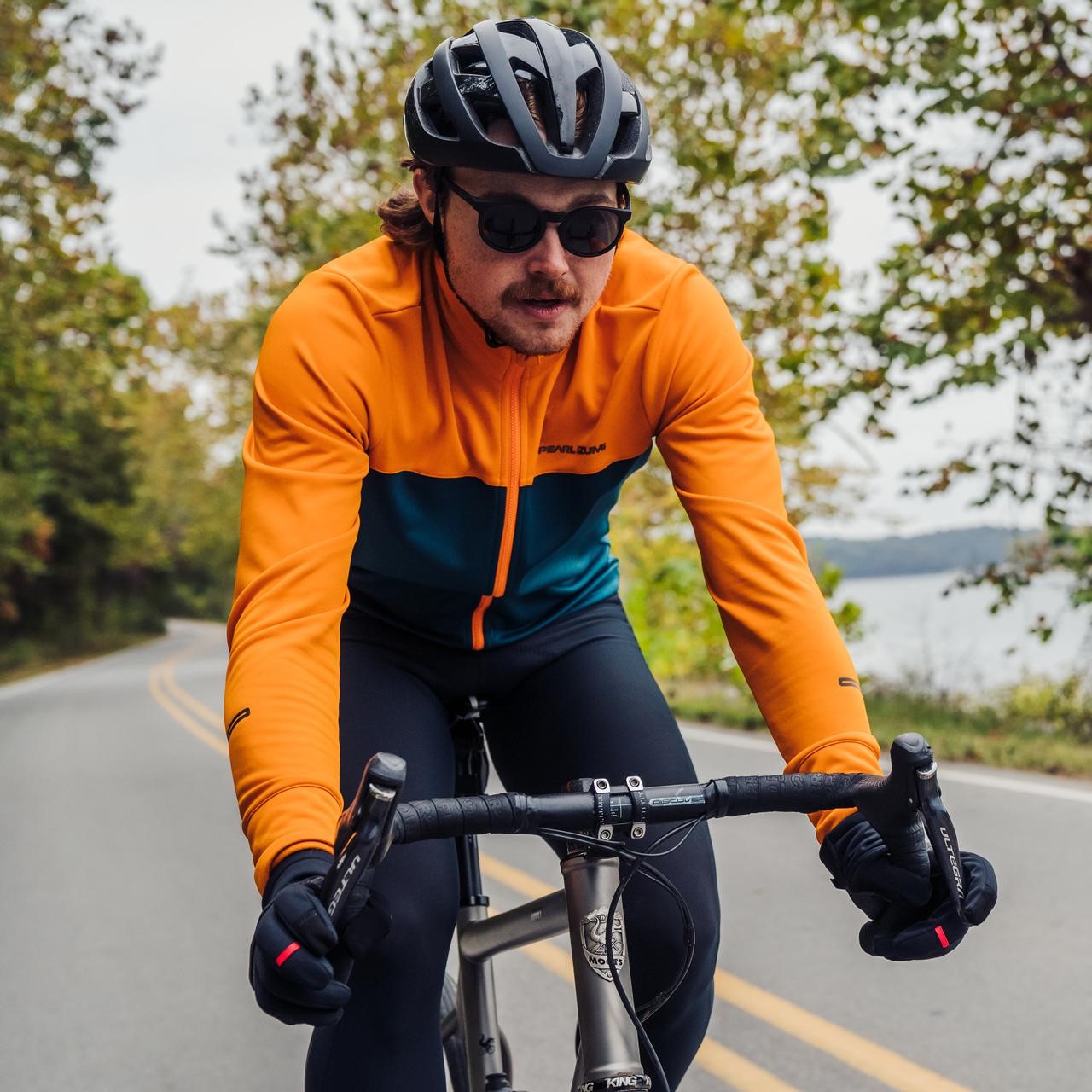 A man biking in the cold weather.