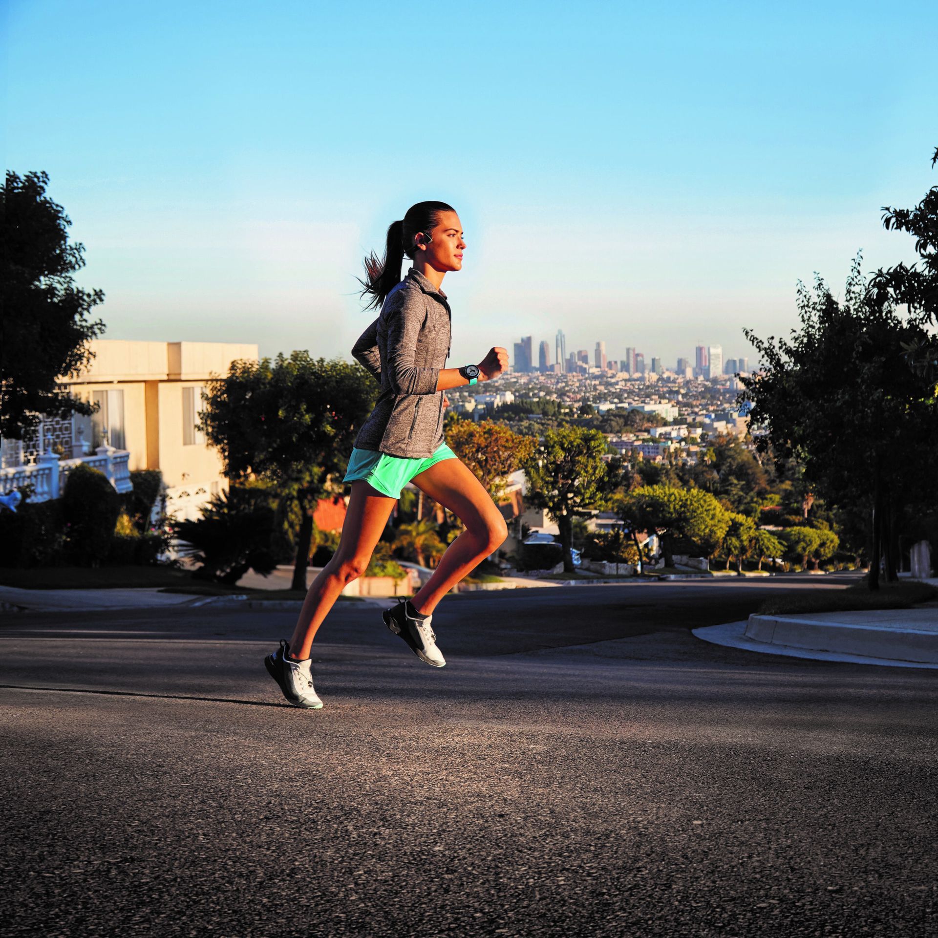 A female runner wearing a Garmin Forerunner 945 LTE