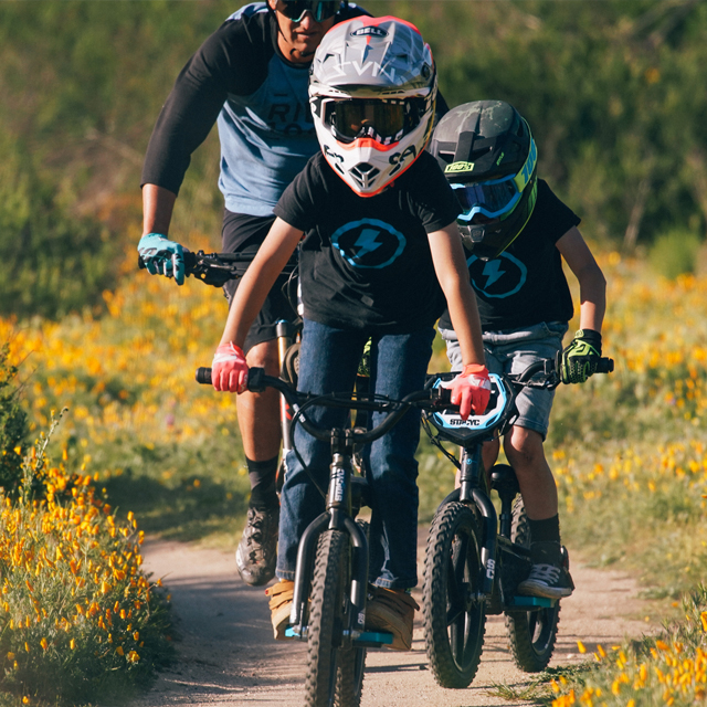 A whole family riding their bikes.
