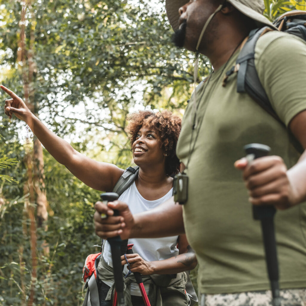 Couple trekking in the forest together