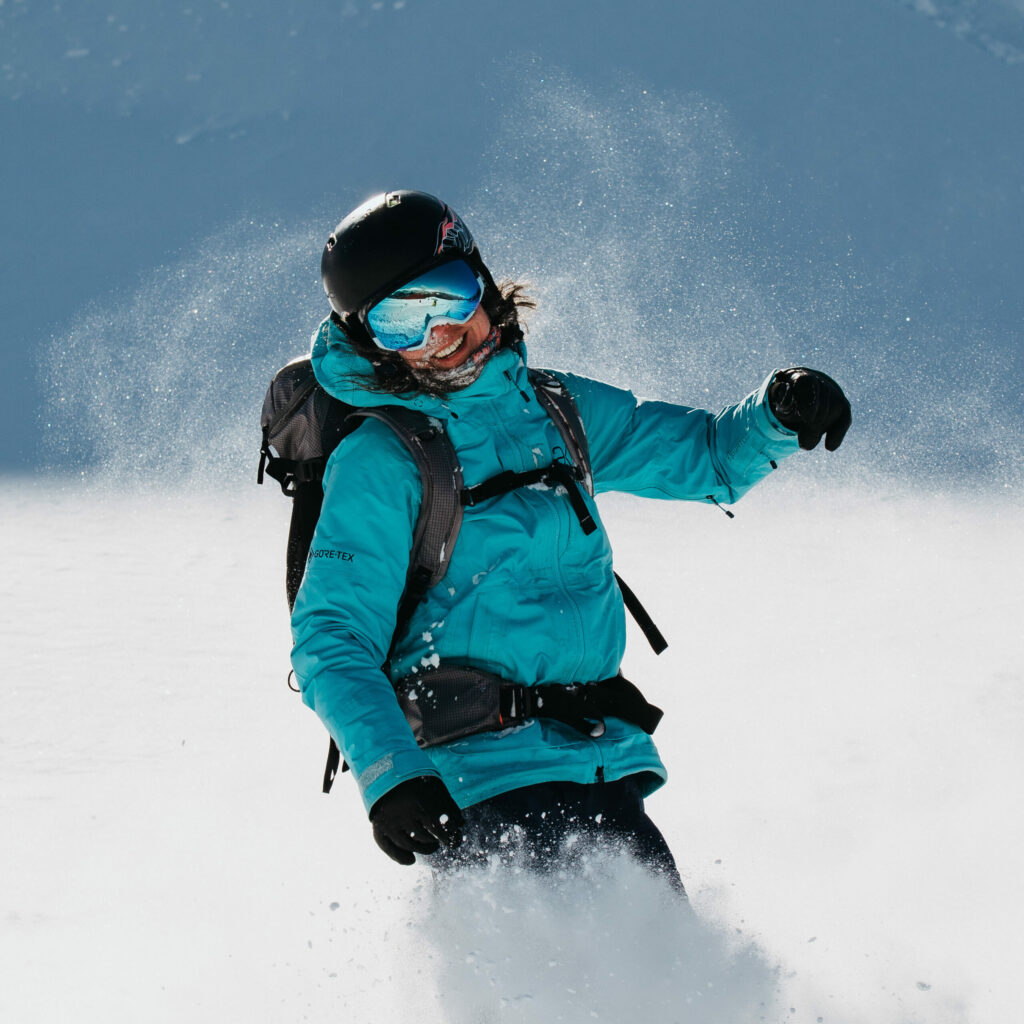 Snow swirling around a snowboarder.
