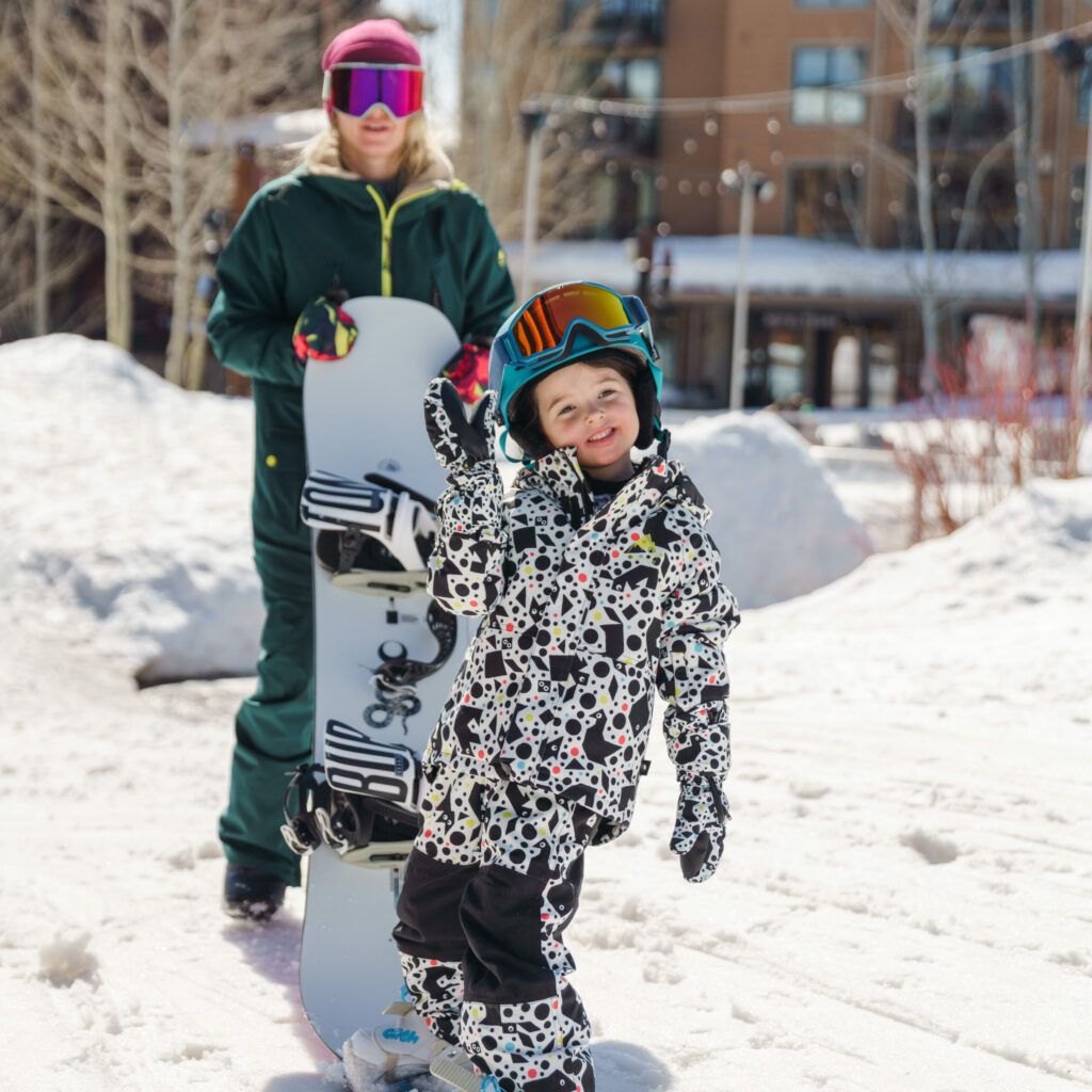 A cute girl with her snowboard.