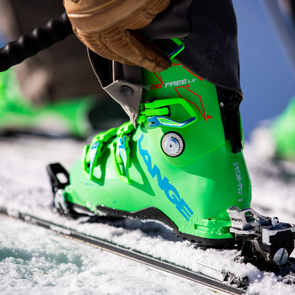 Someone adjusting their ski boots.