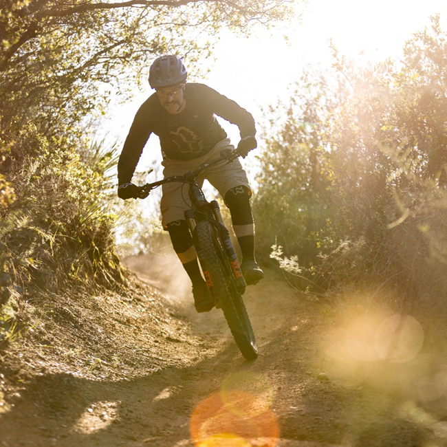 Man shredding mountain bike trails.