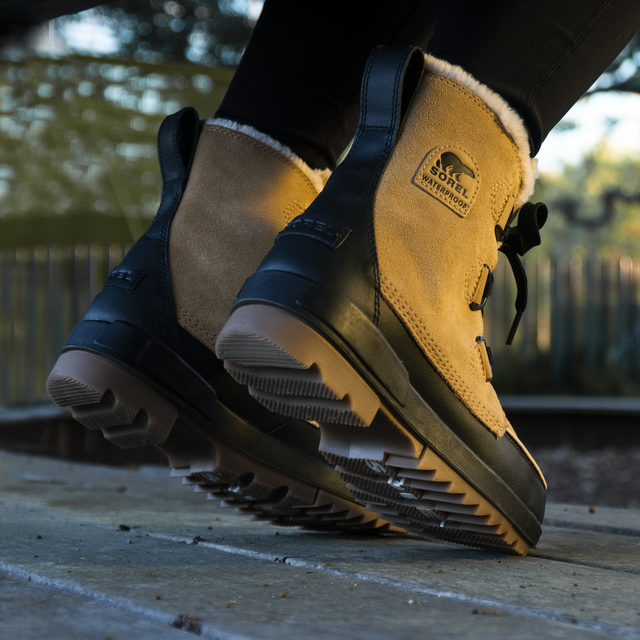 Demonstrating Sorel Waterproof Boots.
