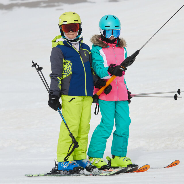 Two young skiiers with their Giro Helmets.
