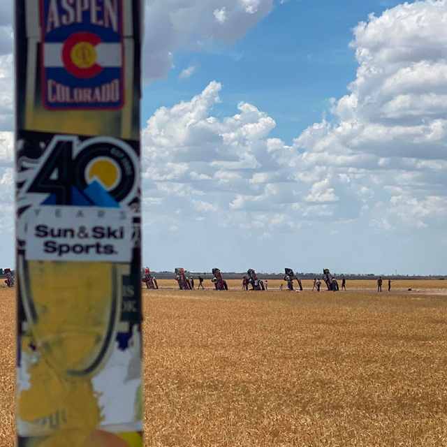 Sun & Ski Sports' custom 40th anniversary sticker displayed at the Cadillac Ranch.