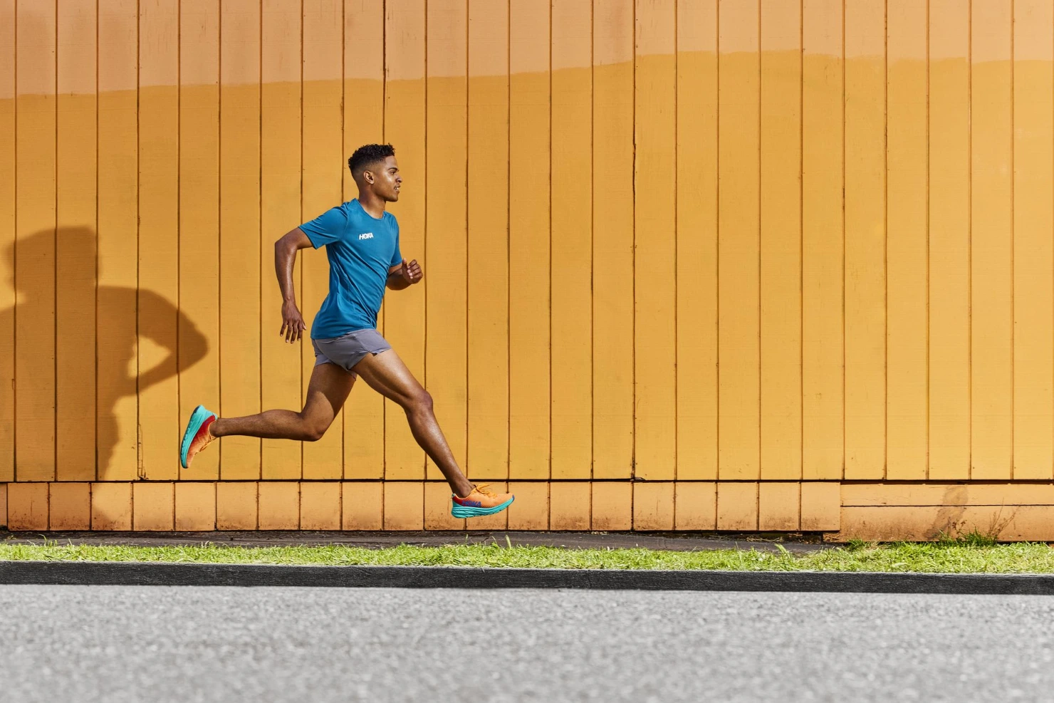 man running in best hoka rincon shoes