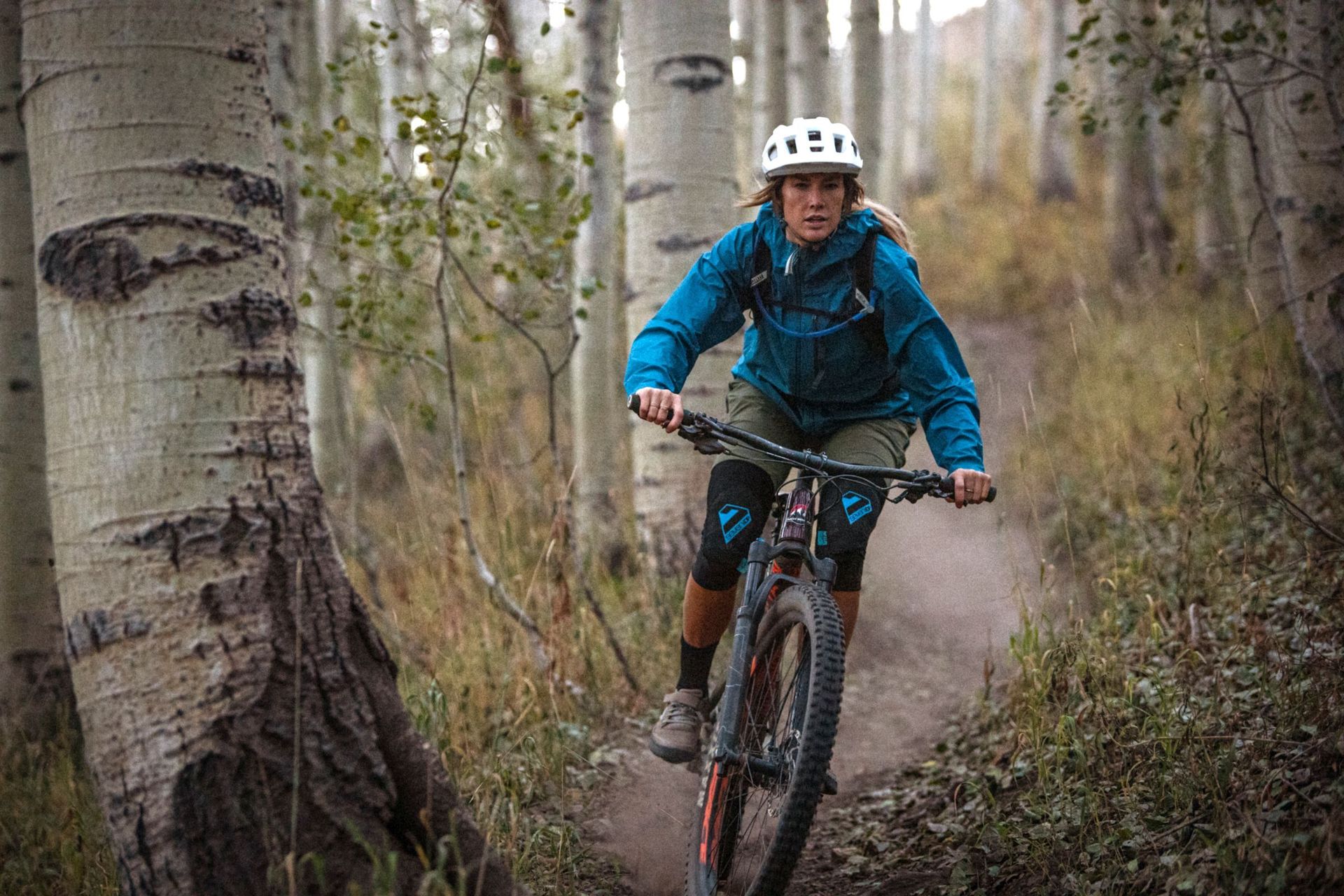 Women hitting the bike trails in a waterproof rain jacket.