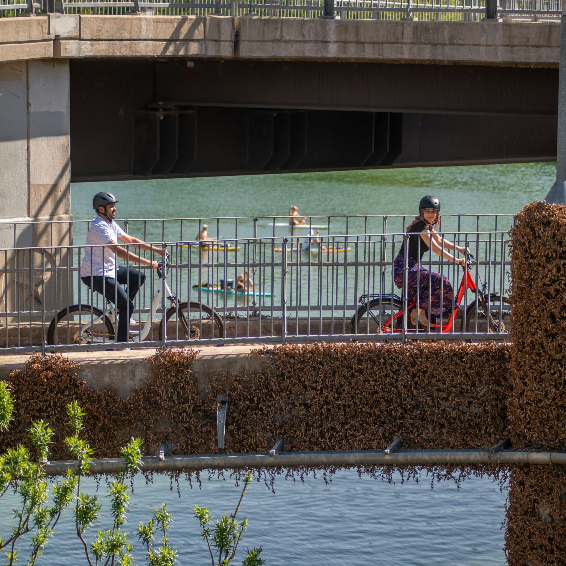 Two people bike path riding in Austin.