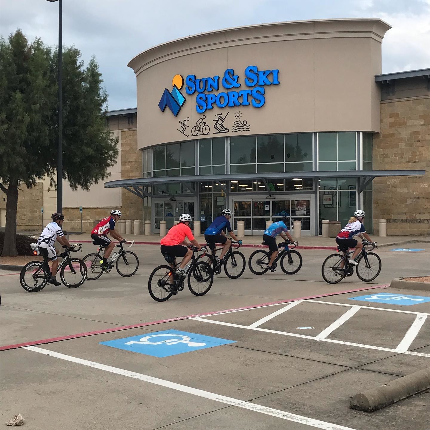 Cyclists taking off from Sun & Ski Sports in Frisco to go bike path riding.