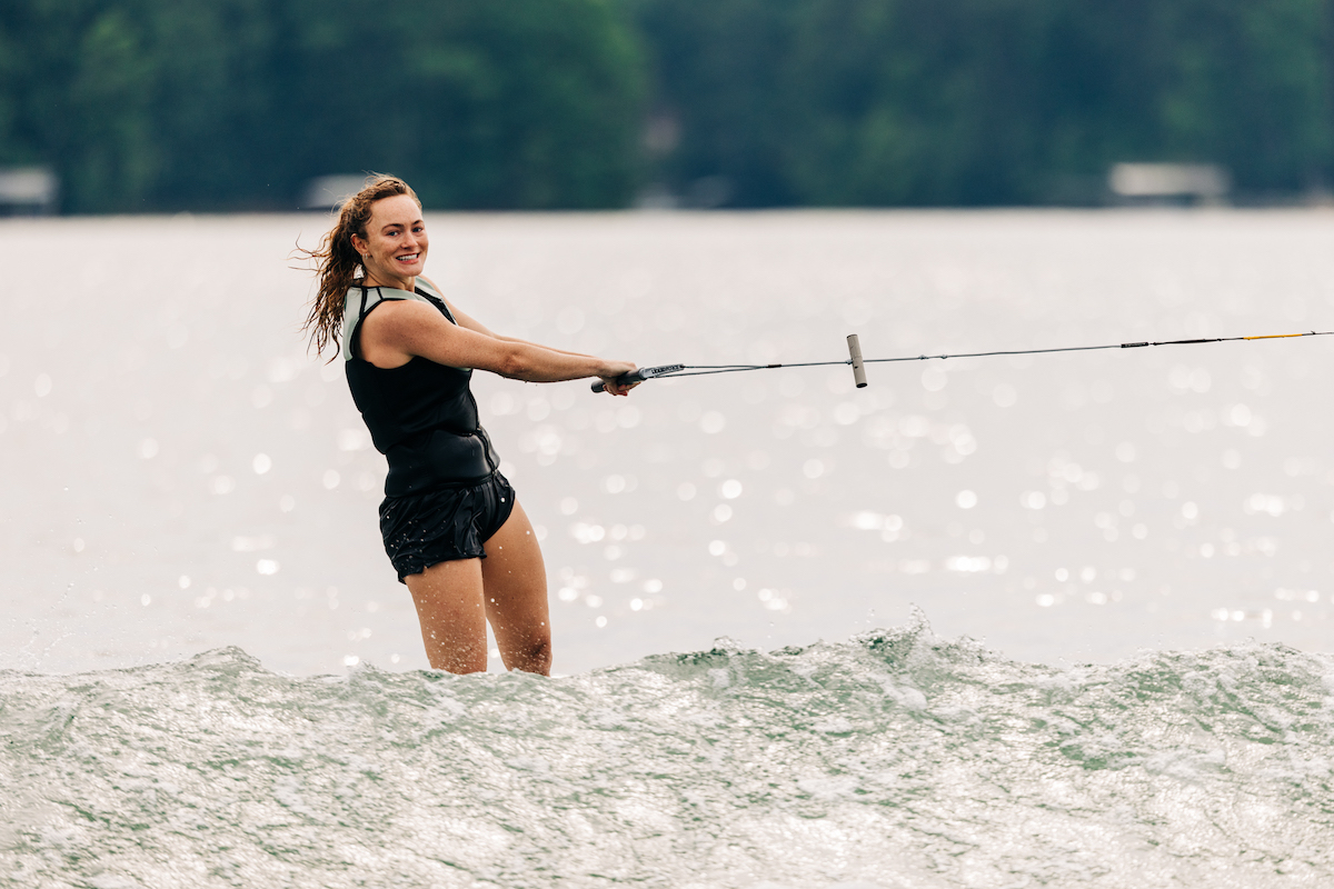 behind boat with tow handle woman