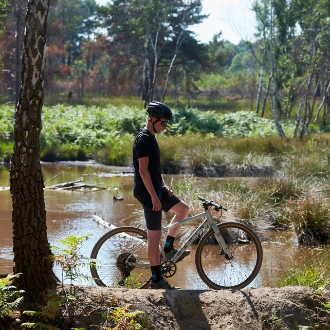 Man wearing protective gear while mountain biking.