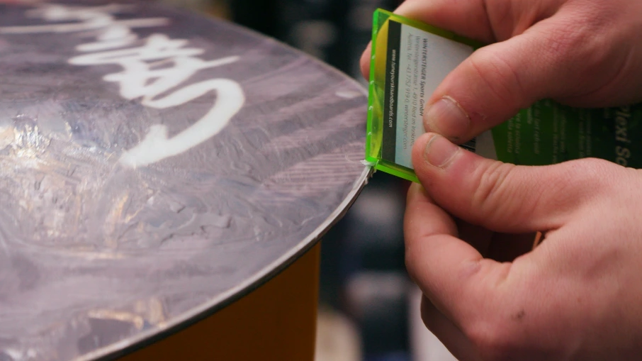Handwaxing a snowboard