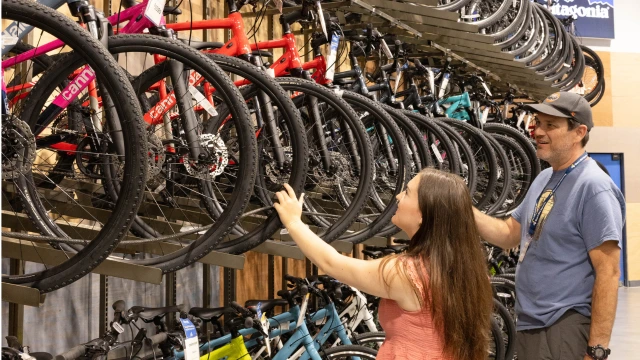 A woman trading in her bike at Sun & Ski Sports